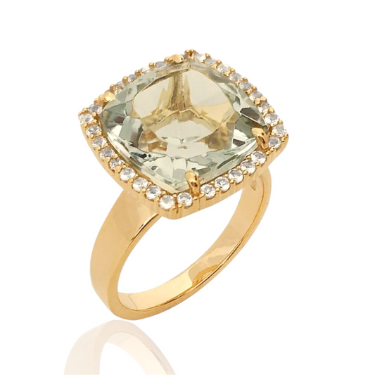 Gold ring with a large green gemstone and smaller diamonds on a white background
18K Yellow Gold Vermeil over 925 Silver - 3.7 grs
Cushion cut Prasiolite - 12mm cushion gemstone w/ 5.6 cts
32 White Topaz round 1.0 mm diamond cut