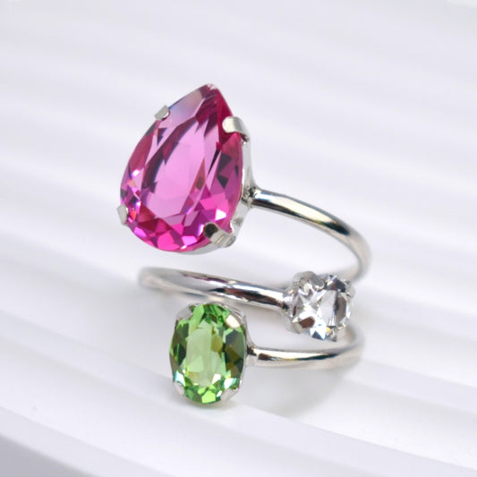 Two silver rings with pink and green gemstones on a white background
Material: sterling silver, rhodium plated, bright pink, white and light green Swarovski crystals

Color: silver, bright pink, white and light green

Ring type: statement

Size: 7.5