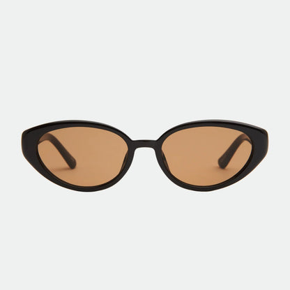 Cat-eye sunglasses with brown lenses on a light gray background