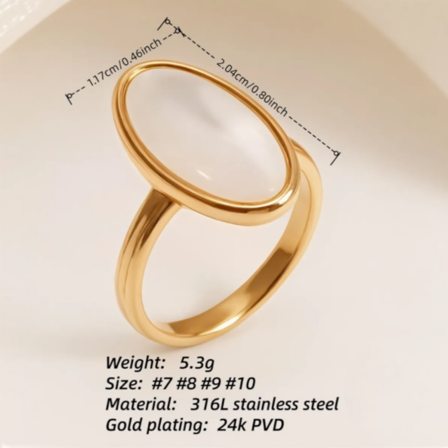 gold with white oval deign ring 