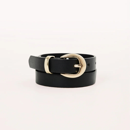 Black belt with a gold buckle on a light gray background