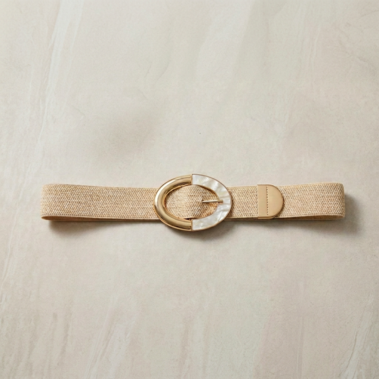 Beige belt with a decorative buckle on a beige background
