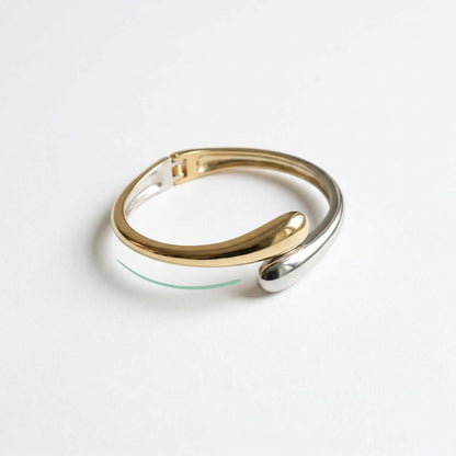 Gold and silver ring on a white background