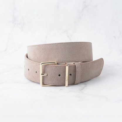 Beige belt with a gold buckle on a light gray background