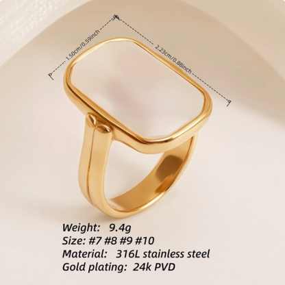 Gold ring with measurements and material details on a beige background