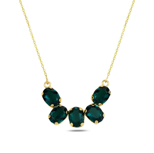 Gold necklace with green Swarovski crystals on a white background