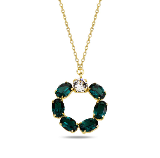 Gold necklace with green swarovski crystals pendant on a white background