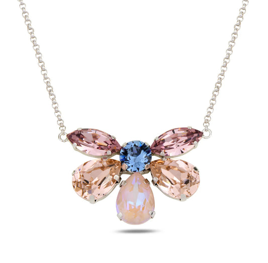 Necklace with pink and blue crystals on a white background
Material: 925 sterling silver, rhodium-plated, 6 Swarovski crystals&nbsp;

Color: silver, light pink, light blue, purple, and opal&nbsp;

Measurement: 14" length, 1" extension, 1 mm wide chain, pendant: 3.5 cm x 2.5 cm