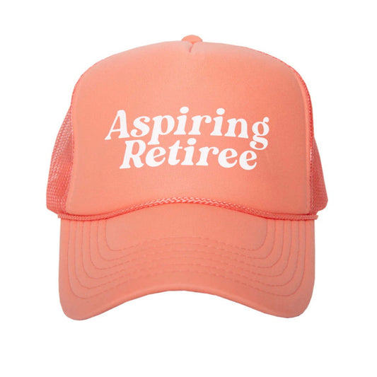 coral colored cap with 'Aspiring Retiree' text on a white background
