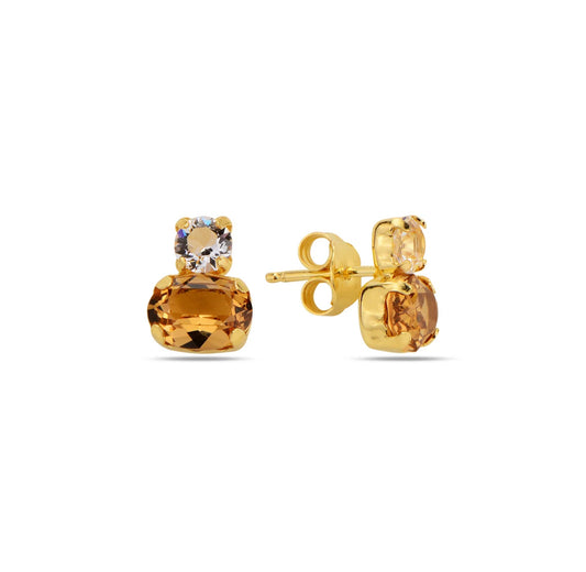 Gold earrings with gemstones on a white background