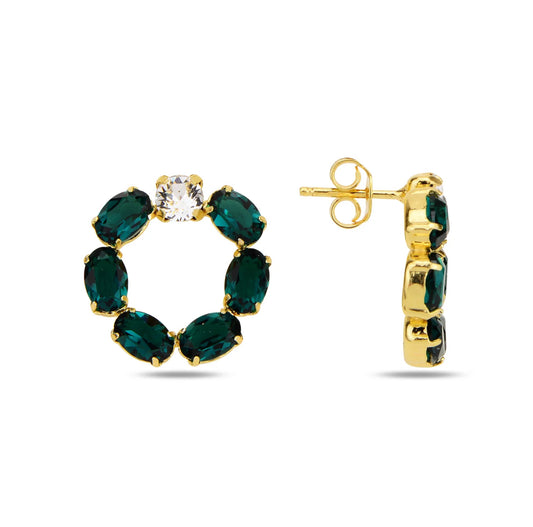 Gold hoop earrings with green swarovski crystals on a white background
