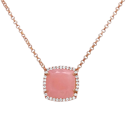 Necklace with a pink stone and rose gold chain on a white background
18K Rose Gold Vermeil over 925 Silver - 3.7 grs
Cushion cut Rose Chalcedony - 12mm cushion gemstone w/ 5.6 cts
32 White Topaz round 1.0 mm diamond cut