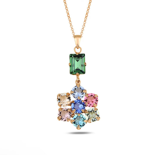 Multicolored Swarovski crystal pendant on a gold chain against a white background