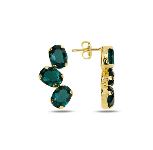 Gold earrings with green swarovski crystal on a white background