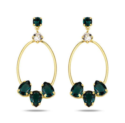 Gold hoop earrings with green Swarovski Crystals on a white background