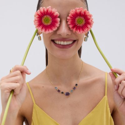 Girl wearing blue and purple swarovski necklace 