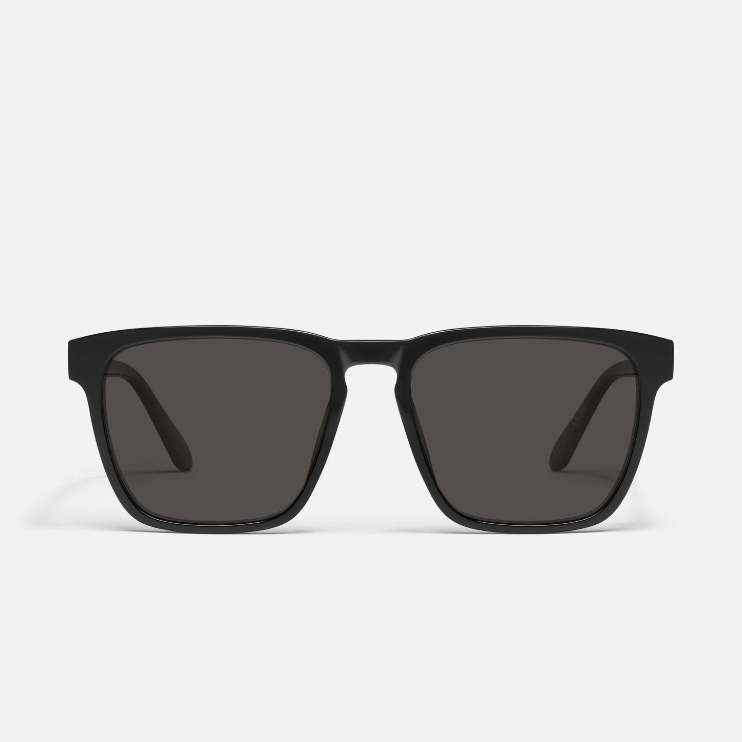 Black sunglasses with dark lenses on a white background