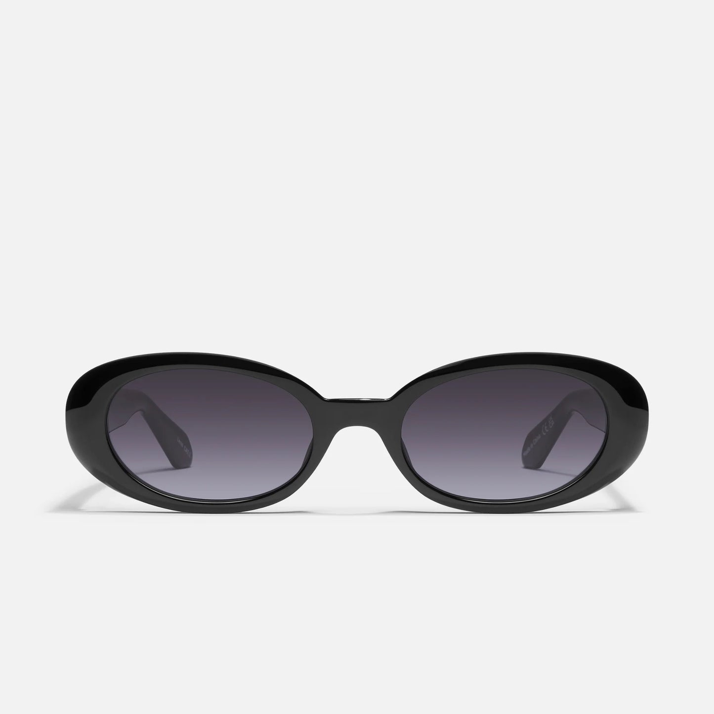 Black sunglasses with dark lenses on a white background
