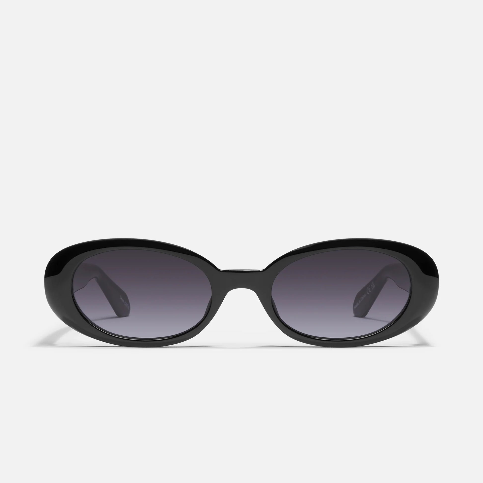 Black sunglasses with dark lenses on a white background