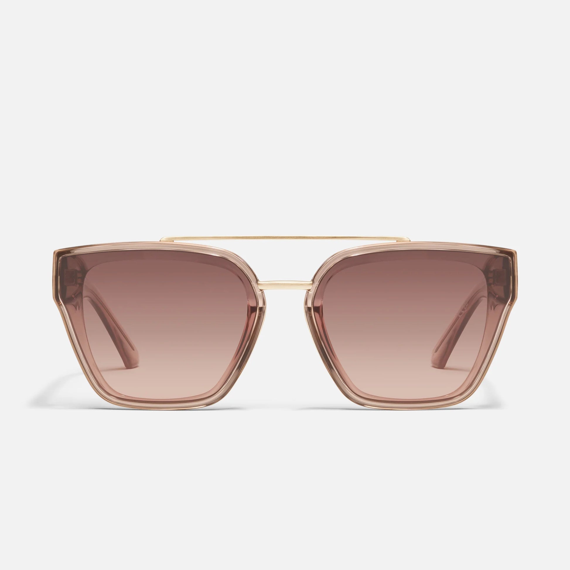 Sunglasses with gold frame and brown lenses on a light gray background