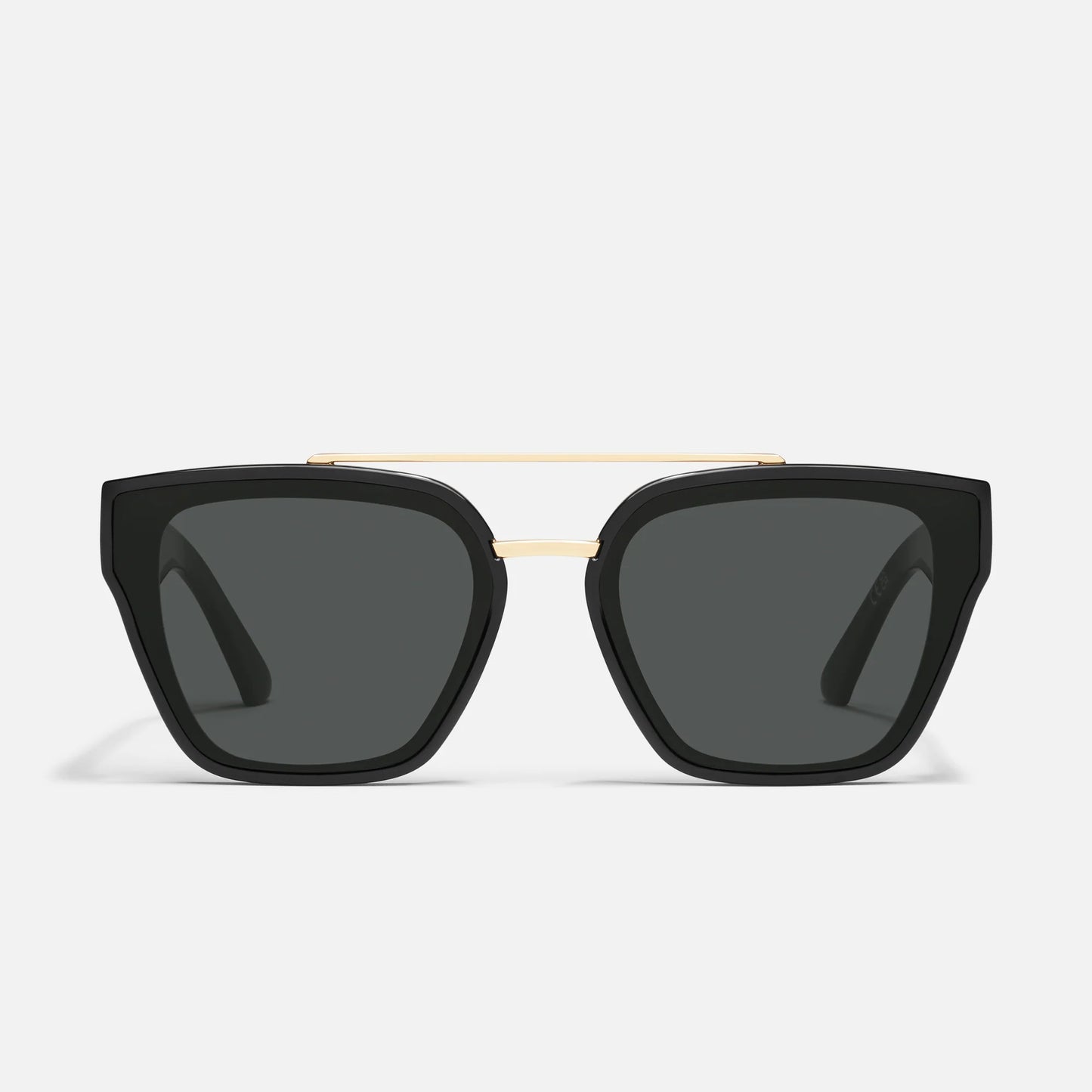 Black sunglasses with gold frame on a white background