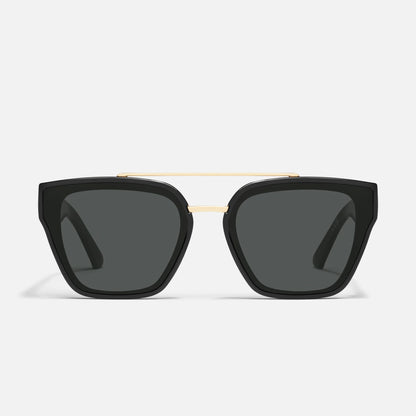 Black sunglasses with gold frame on a white background