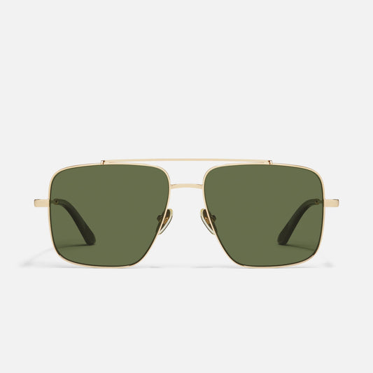 Gold-framed sunglasses with green lenses on a white background