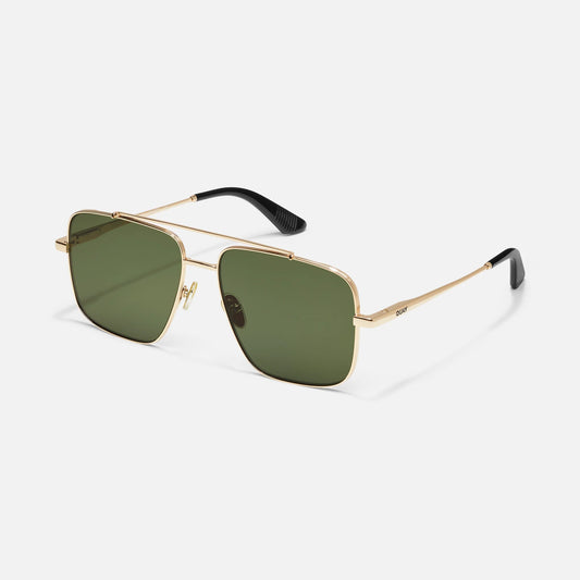 Gold-framed sunglasses with green lenses on a light gray background