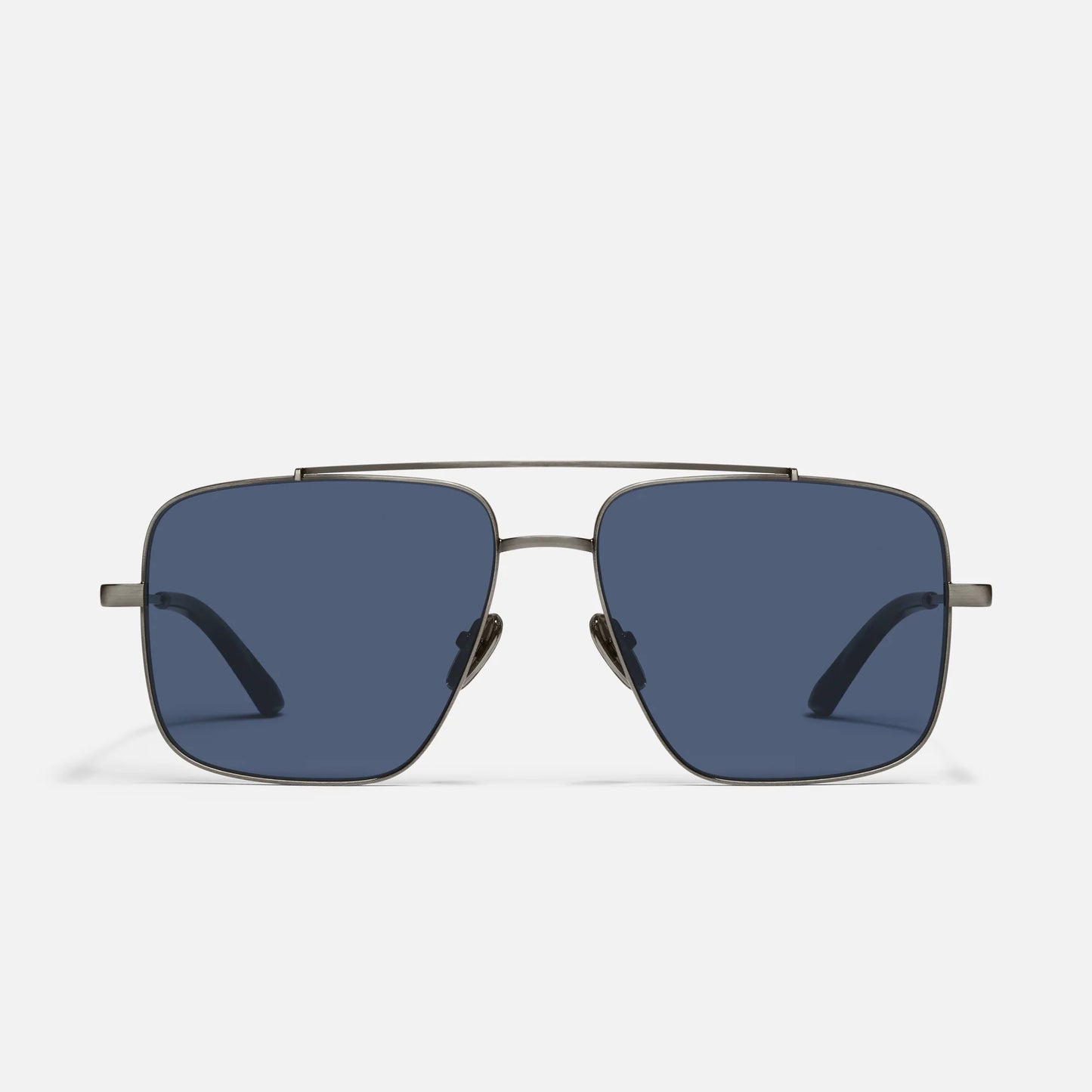Sunglasses with a gold frame and blue lenses on a white background