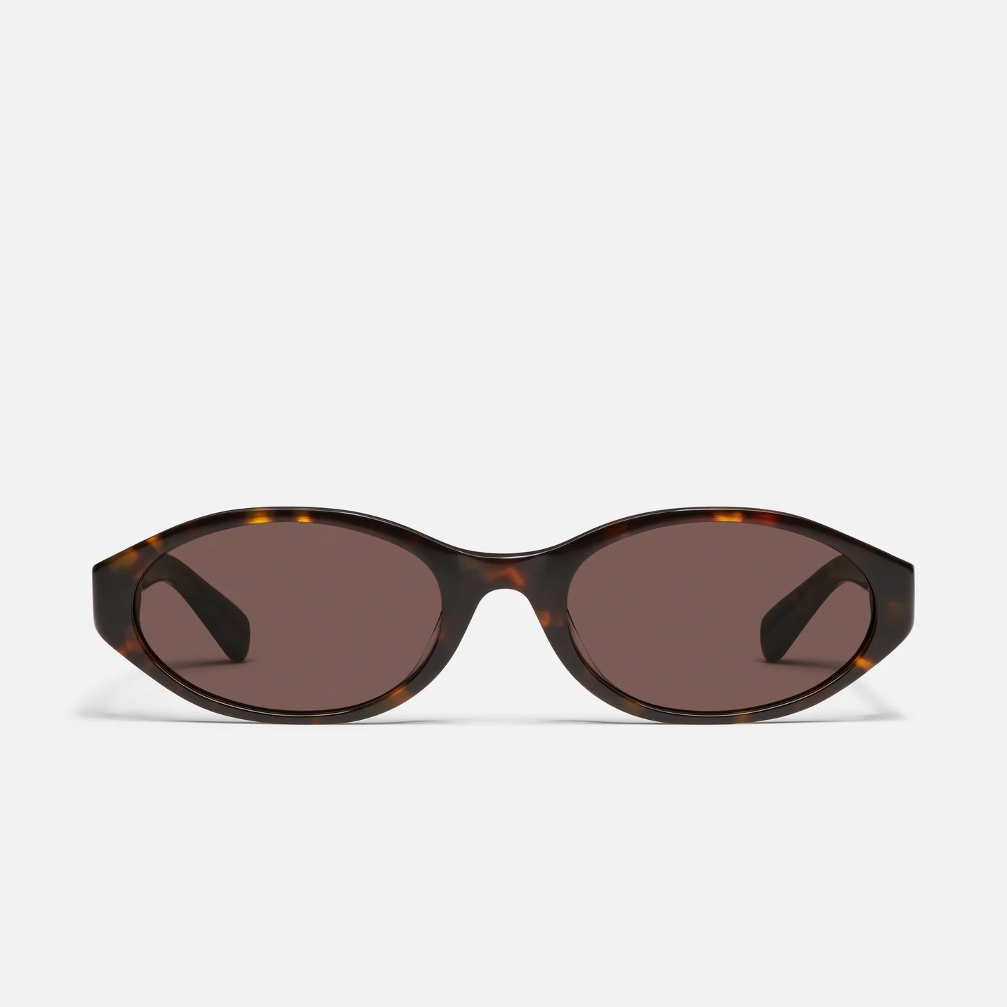 Sunglasses with tortoiseshell frame and dark lenses on a white background