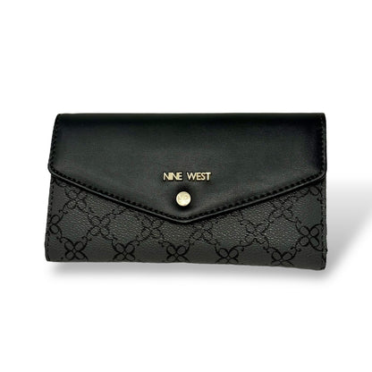 Nine West women’s trifold wallet. Black color with gold toned logo and snap button. Picture featuring front view of closed wallet with the gold toned logo