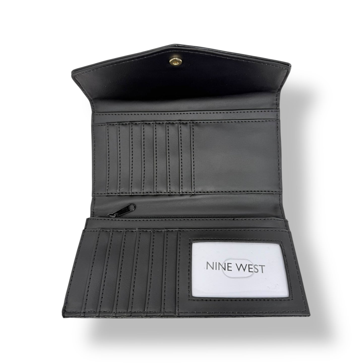Nine West women’s trifold wallet. Black color with gold toned logo and snap button. Picture featuring the interior of the wallet where you can see the ID window, card slots and bill compartments. 