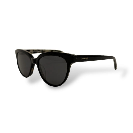 Black sunglasses with a white background
Kate Spade - Cayenne
Frame style: cat-eye light weight
Frame Color: all black outer frame with a black and brown tortoise shell design inside
Lens Color: black gradient
lens technology: 100% UVA/B sun protection