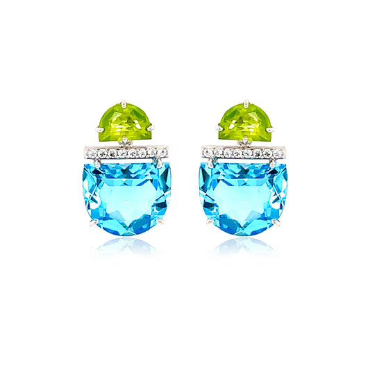 Pair of earrings with blue gemstones and green tops on a white background
Rhodium plated over 925 Silver - 2.5 grs
Half moon cut Sky Blue Topaz, Peridot&nbsp;- 10.6 cts
16 White Topaz round 1.0 mm diamond cut