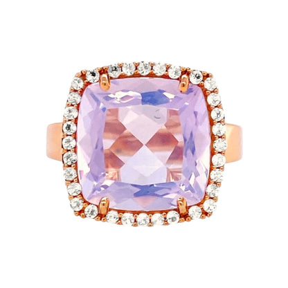 Ring with a large pink gemstone and smaller diamonds on a white background
18K Yellow Gold Vermeil over 925 Silver - 3.7 grs
Cushion cut Lilac Opal Amethyst -&nbsp;12mm cushion gemstone w/ 5.6 cts&nbsp;
32 White Topaz round 1.0 mm diamond cut