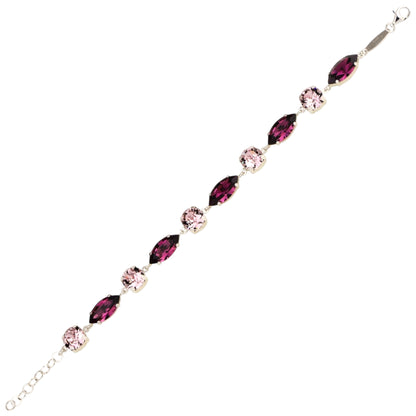 Jewelry bracelet with pink and red gemstones on a white background
Material: 925 sterling silver, Rhodium plated, purple and light rose Swarovski crystals&nbsp;

Color: silver, purple, and light rose

Measurement: 6" length, 1" extension, 6 mm wide&nbsp;