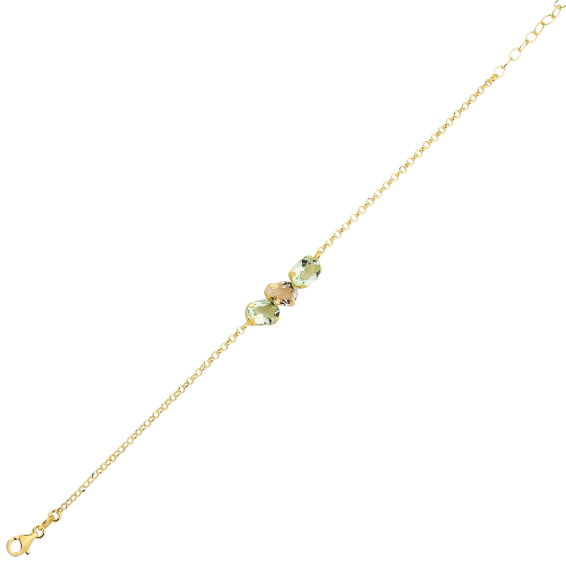 Gold bracelet with green gemstones on a white background
Material: 925 sterling silver, gold plated, light blue with white or light green with white Swarovski crystals&nbsp;

Color: gold, light blue with white or light green with white

Measurement: 6" length, 1" extension, 5 mm wide trio Swarovski Crystals