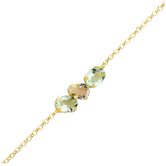 Gold bracelet with green gemstones on a white background
Material: 925 sterling silver, gold plated, light blue with white or light green with white Swarovski crystals&nbsp;

Color: gold, light blue with white or light green with white

Measurement: 6" length, 1" extension, 5 mm wide trio Swarovski Crystals