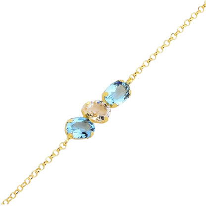 Gold necklace with blue and beige gemstones on a white background
Material: 925 sterling silver, gold plated, light blue with white or light green with white Swarovski crystals&nbsp;

Color: gold, light blue with white or light green with white

Measurement: 6" length, 1" extension, 5 mm wide trio Swarovski Crystals