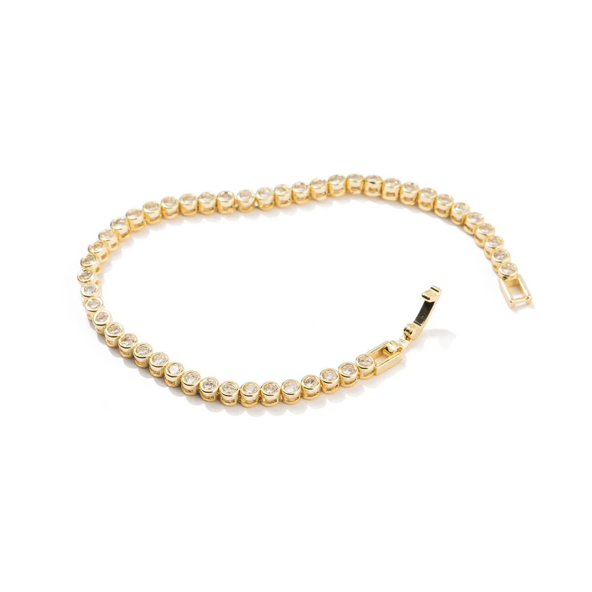 Gold bracelet with clear stones on a white background