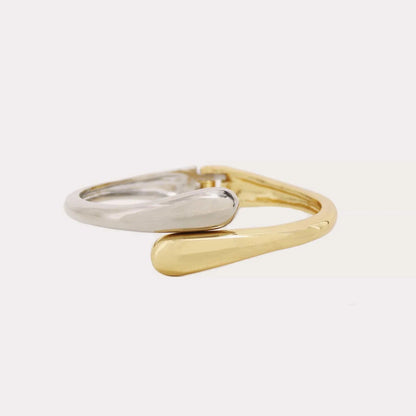 Two gold and silver rings on a white background