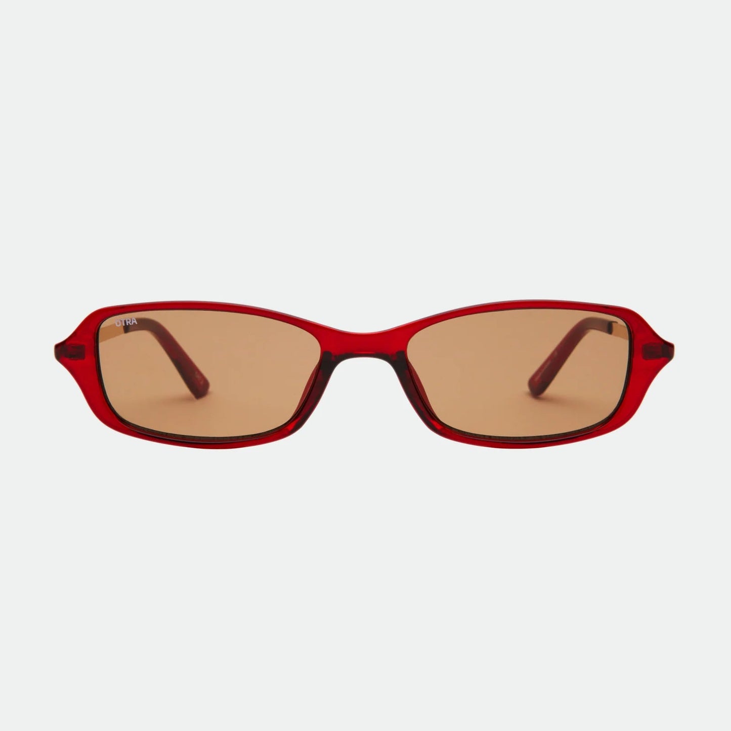 Red sunglasses with brown lenses on a white background