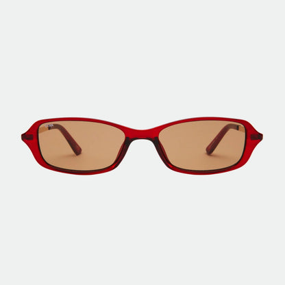 Red sunglasses with brown lenses on a white background