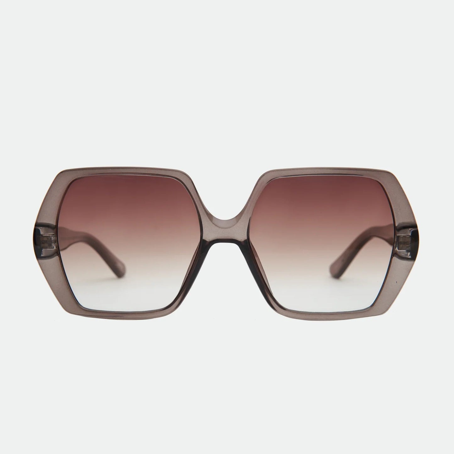 Sunglasses with a gradient brown lens on a light gray background