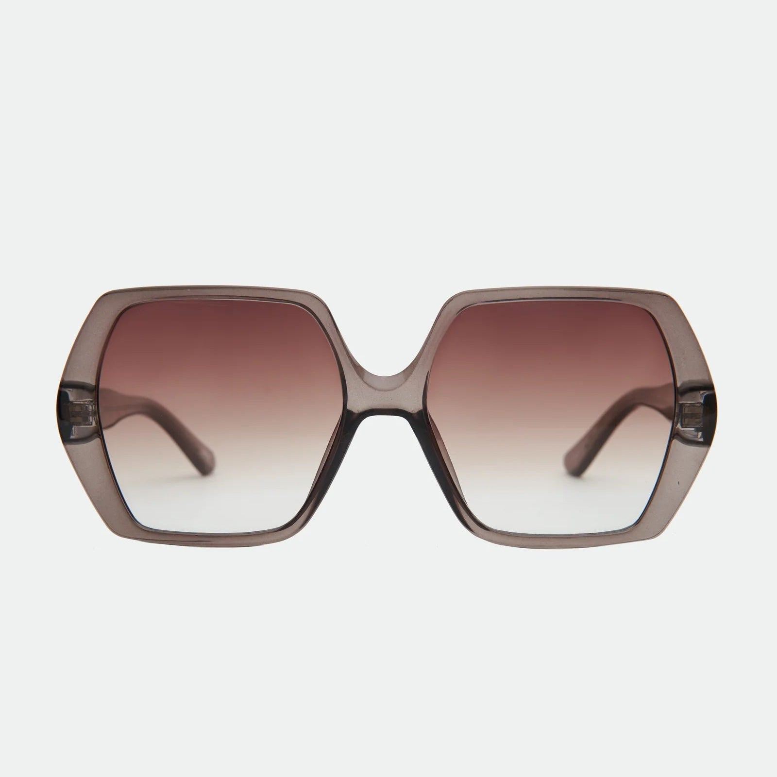 Sunglasses with a gradient brown lens on a light gray background