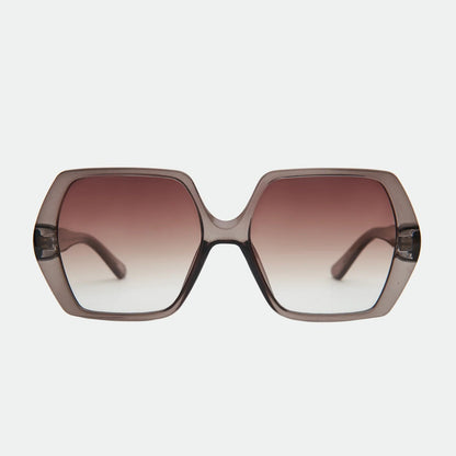 Sunglasses with a gradient brown lens on a light gray background