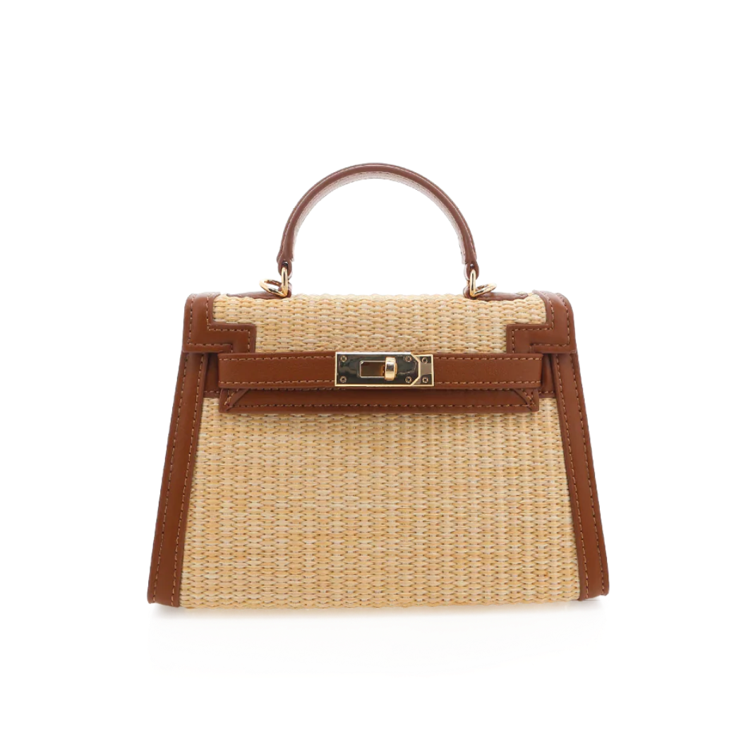 Handbag with woven design and brown leather accents on a white background