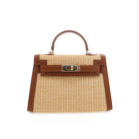 Handbag with woven design and brown leather accents on a white background