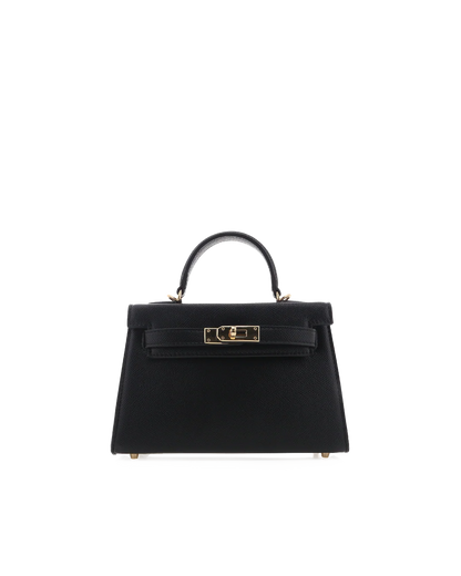 Black handbag with gold hardware on a white background