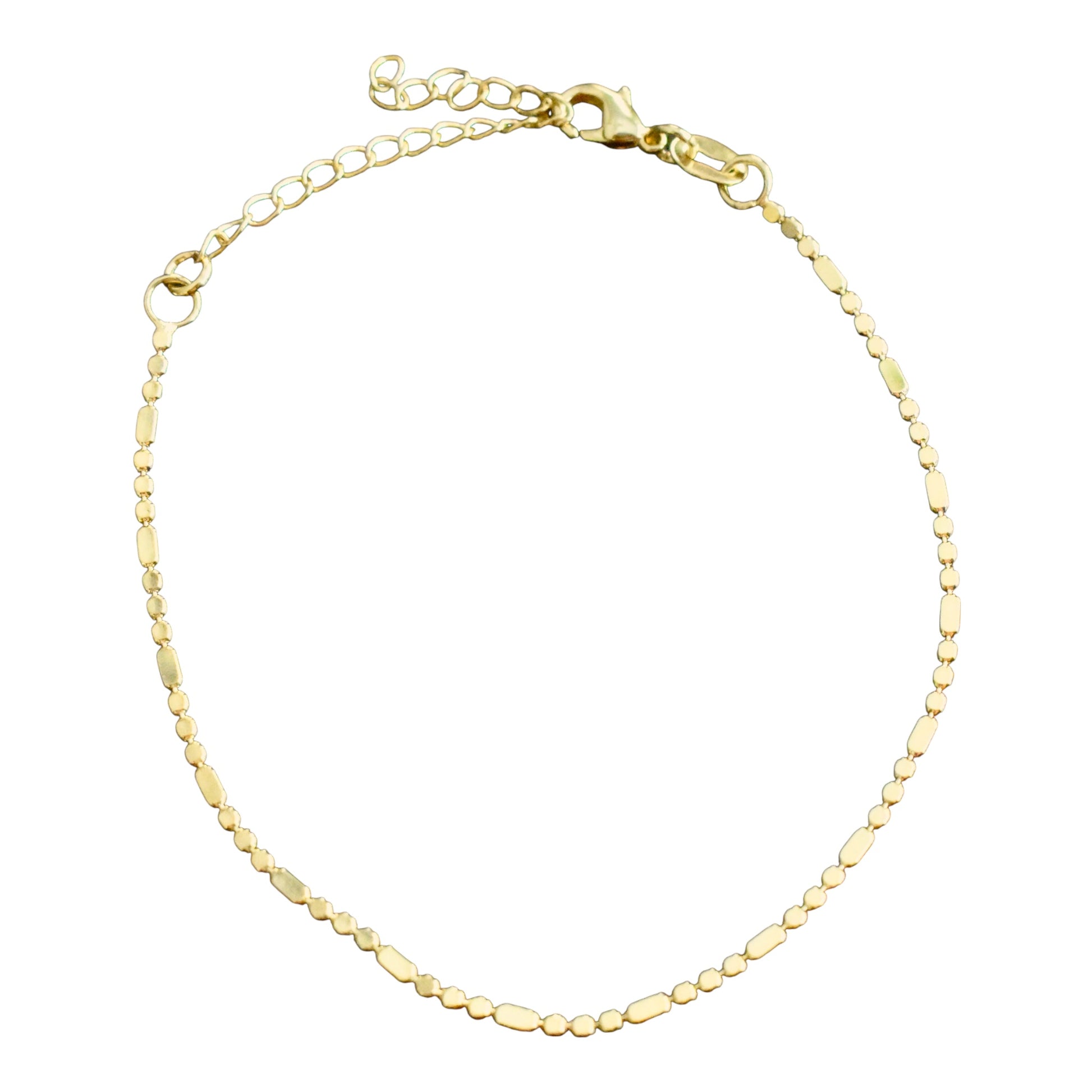 Gold bracelet on a white background